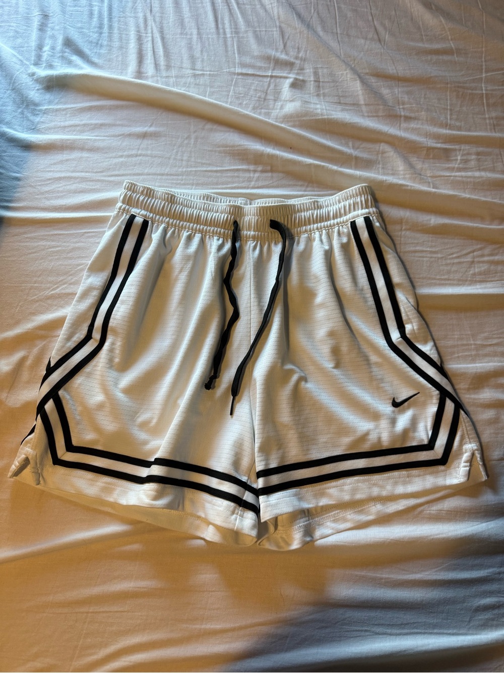 Nike White Women's Athletic Shorts with Black Stripe Trim
